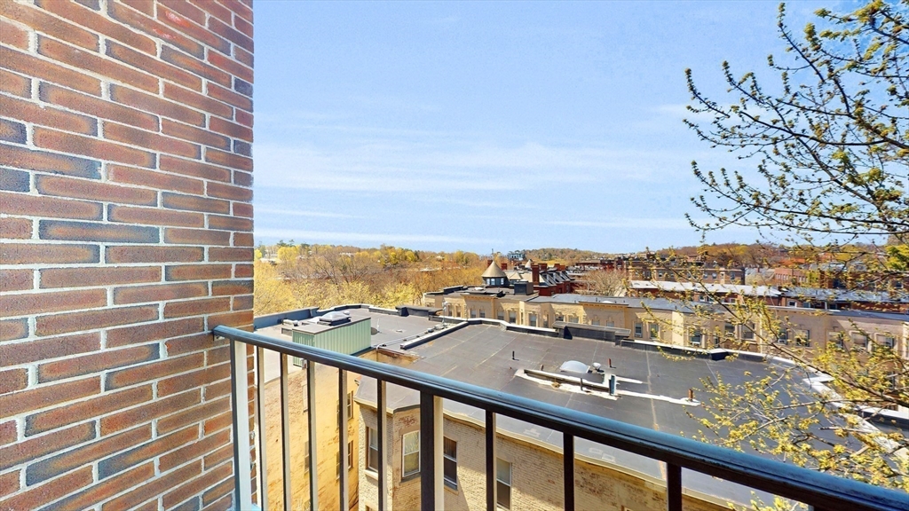 1856 Beacon Street, Unit 6F Brookline, MA 02445 - Photo 8 of 17 a view of a balcony with an ocean view