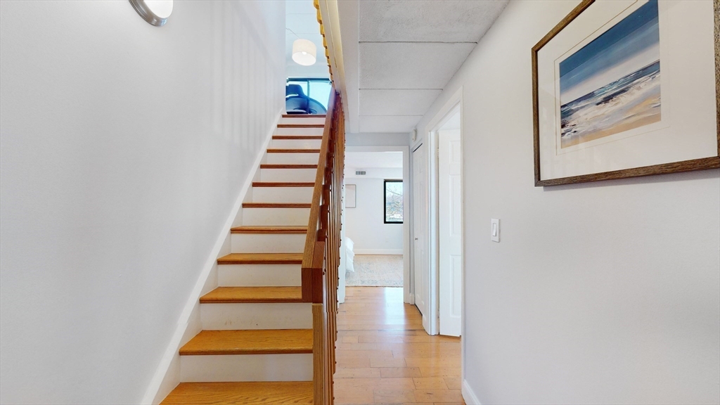 1856 Beacon Street, Unit 6F Brookline, MA 02445 - Photo 9 of 17 a view of entryway with wooden floor