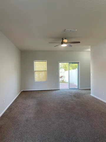 a kitchen with wooden cabinets and stainless steel appliances