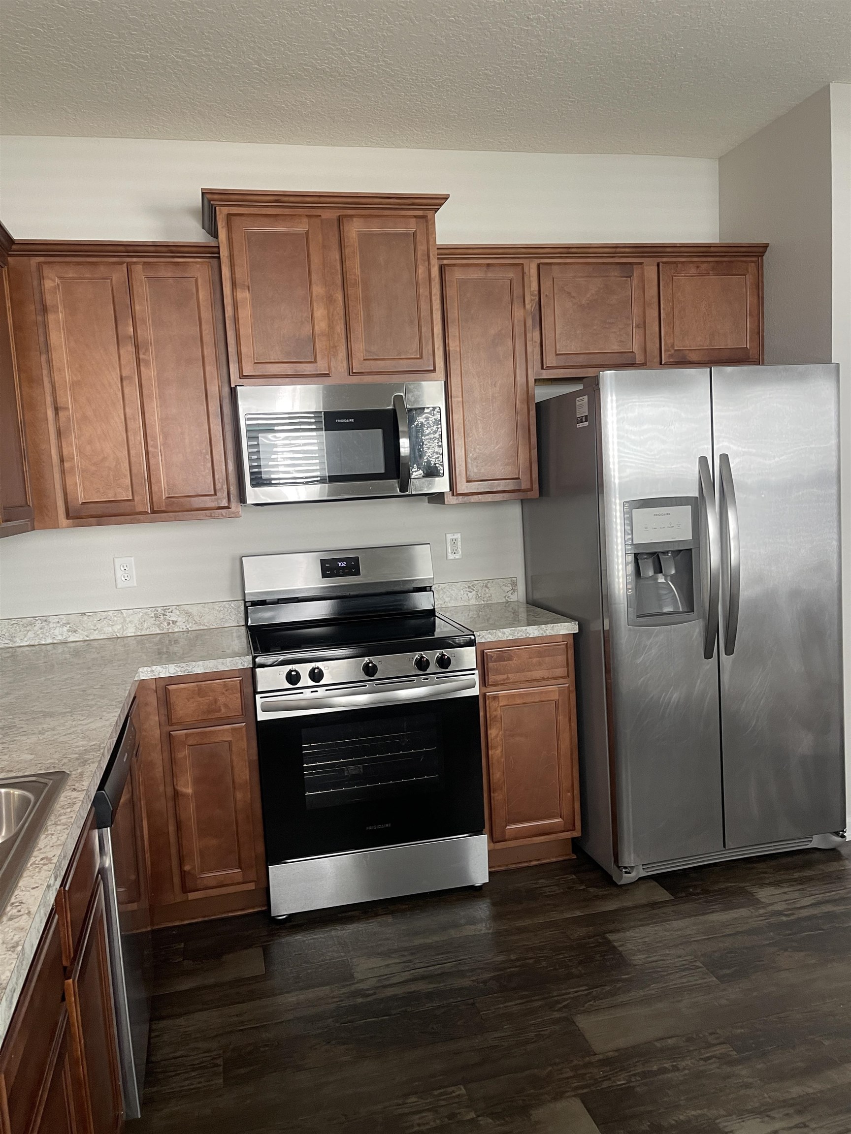 55 Buckley Court St. Augustine, FL 32086 - Photo 14 of 22 a kitchen with wooden cabinets and stainless steel appliances