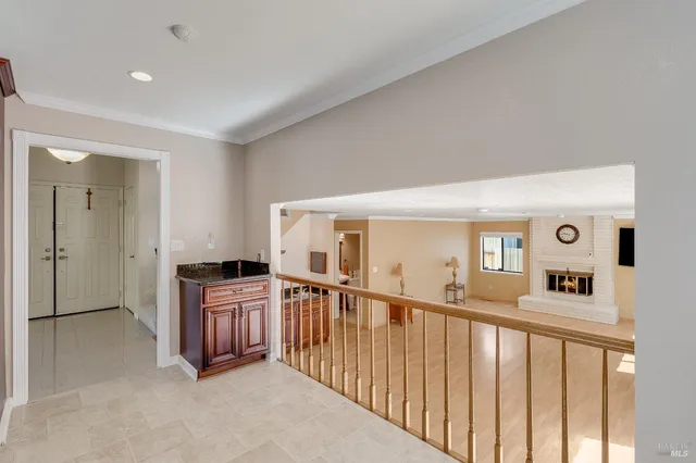 a view of a living room with furniture and windows