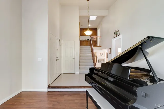 a view of an empty room and wooden floor