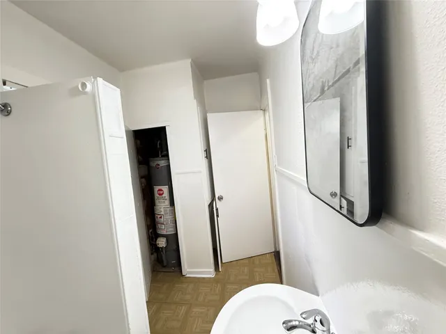a bathroom with a sink and toilet