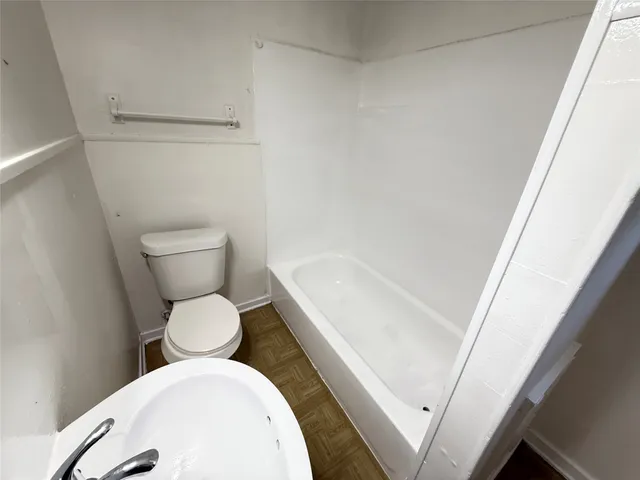 a bathroom with a toilet and a sink