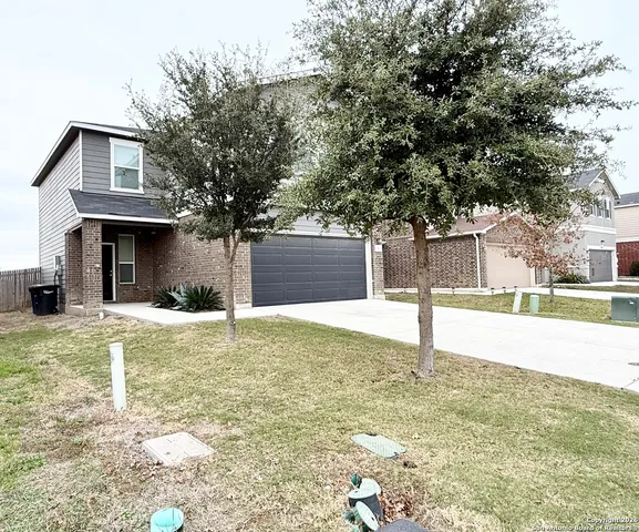 a swimming pool in front of a house