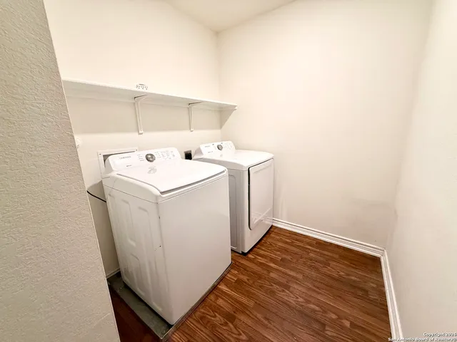 a view of a big room with closet and wooden floor