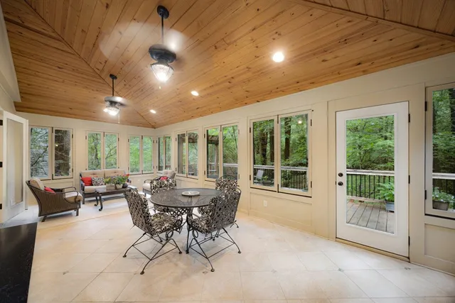 a view of a dining room with furniture window and outside view