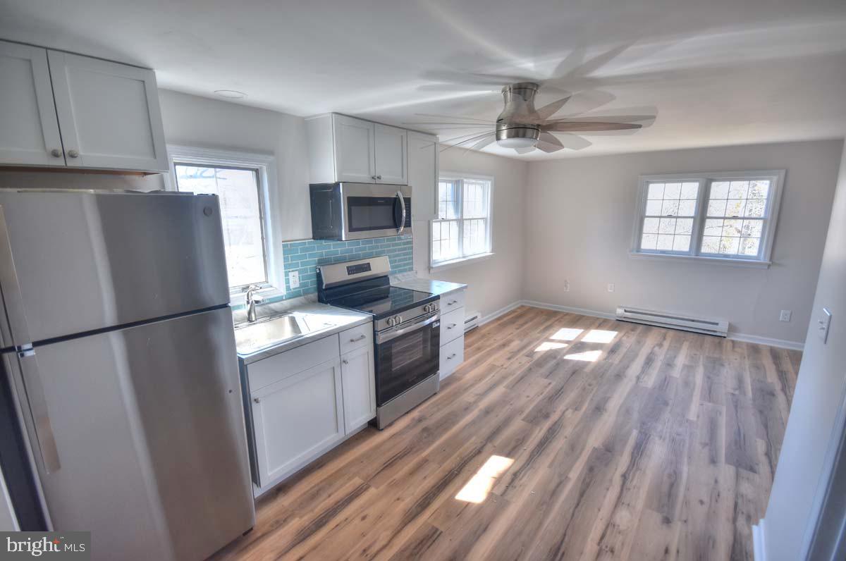 654 Helena Avenue Mantua, NJ 08051 - Photo 25 of 42 Bright and airy modern kitchen space.