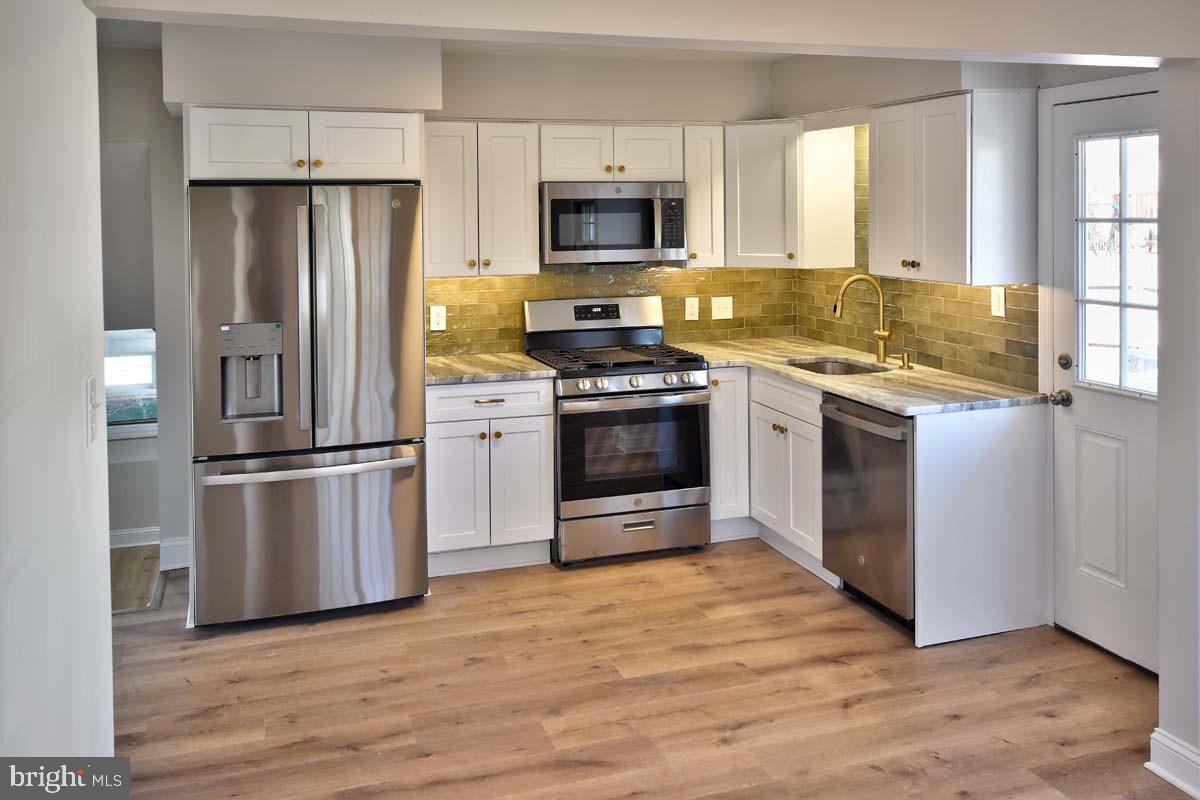 654 Helena Avenue Mantua, NJ 08051 - Photo 8 of 42 Modern kitchen with sleek appliances.