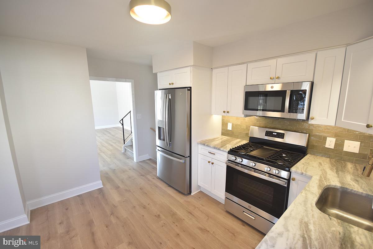 654 Helena Avenue Mantua, NJ 08051 - Photo 9 of 42 Modern kitchen with sleek appliances.