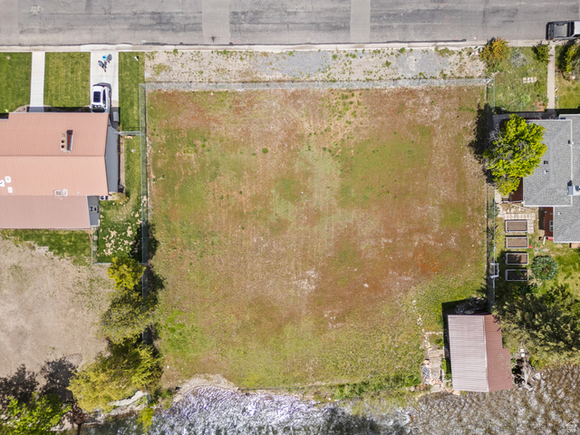 472 East 300 South Logan, UT 84321 - Photo 9 of 9 Expansive land parcel featuring natural ground cover, street frontage, and waterfront access