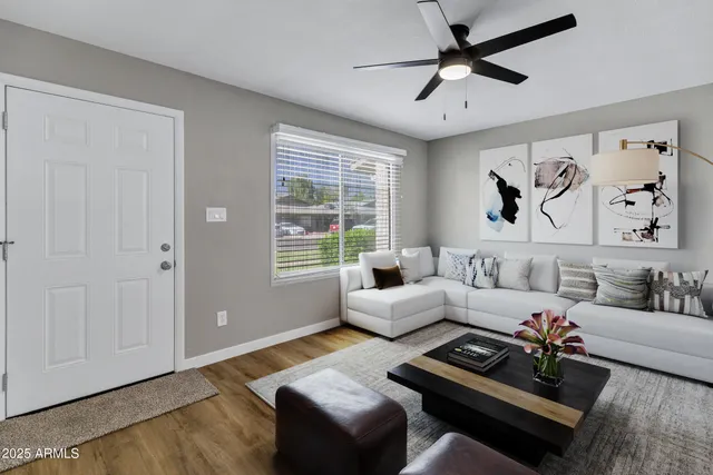 a living room with furniture and a large window