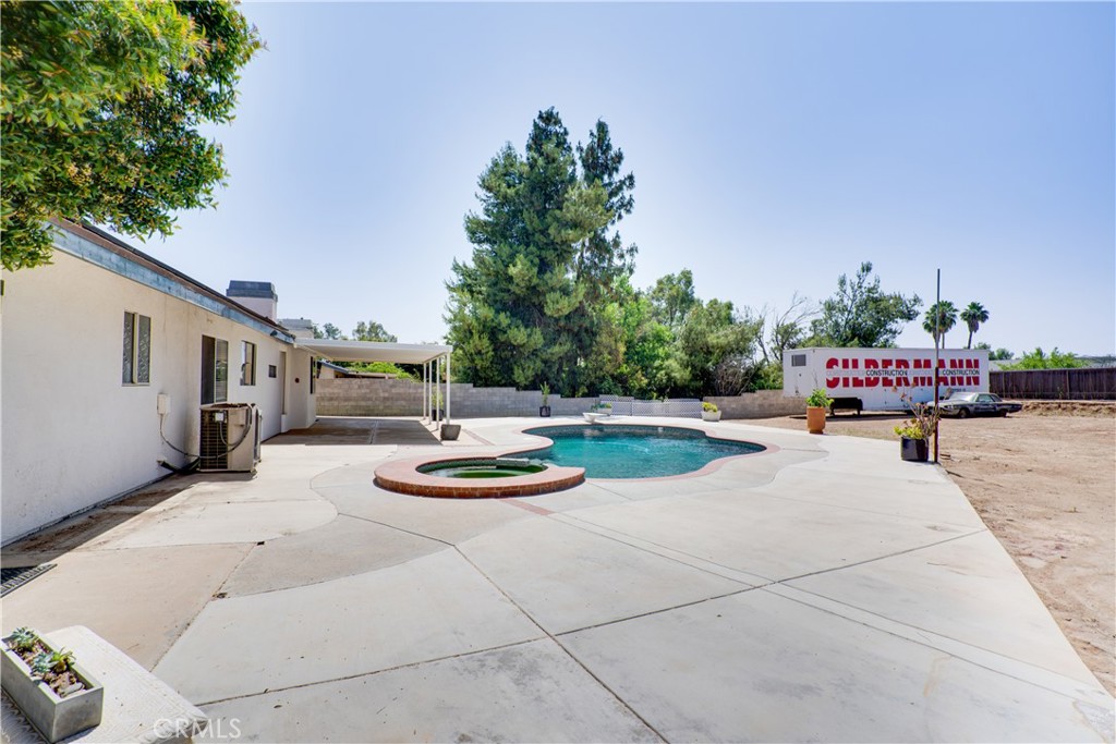 18825 Mariposa Avenue Riverside, CA 92508 - Photo 13 of 55 a swimming pool with outdoor seating and green space