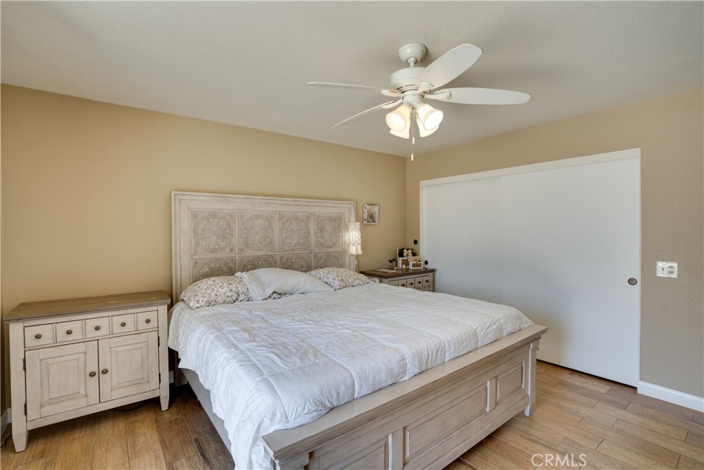 18825 Mariposa Avenue Riverside, CA 92508 - Photo 29 of 55 a bedroom with a bed and a chandelier