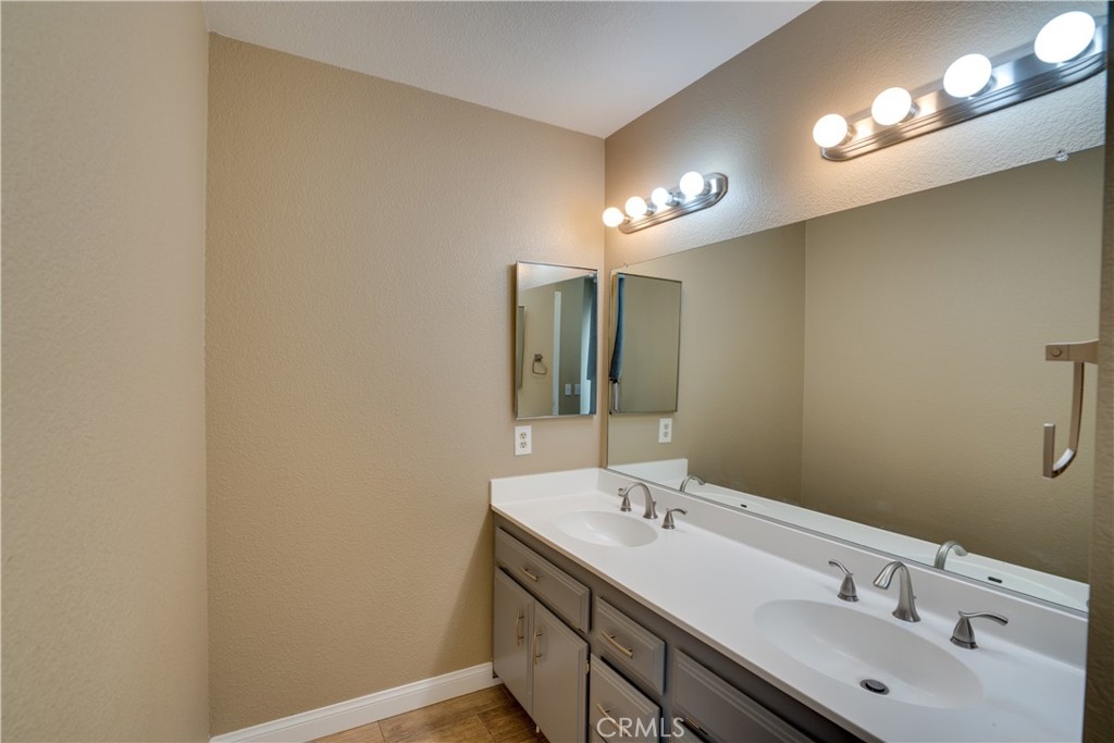 18825 Mariposa Avenue Riverside, CA 92508 - Photo 31 of 55 a bathroom with a sink and a mirror