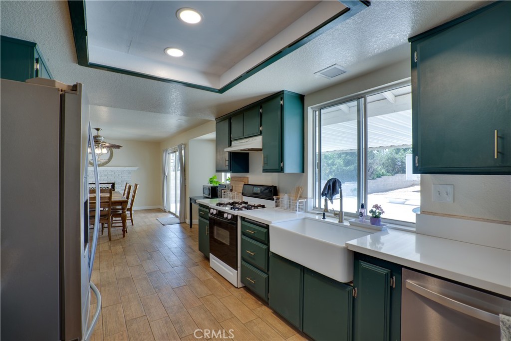 18825 Mariposa Avenue Riverside, CA 92508 - Photo 34 of 55 a kitchen with lots of counter top space and stainless steel appliances