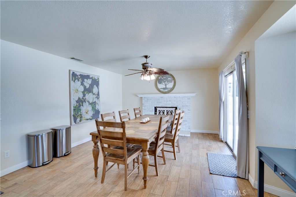 18825 Mariposa Avenue Riverside, CA 92508 - Photo 35 of 55 a view of a dining room with furniture and wooden floor