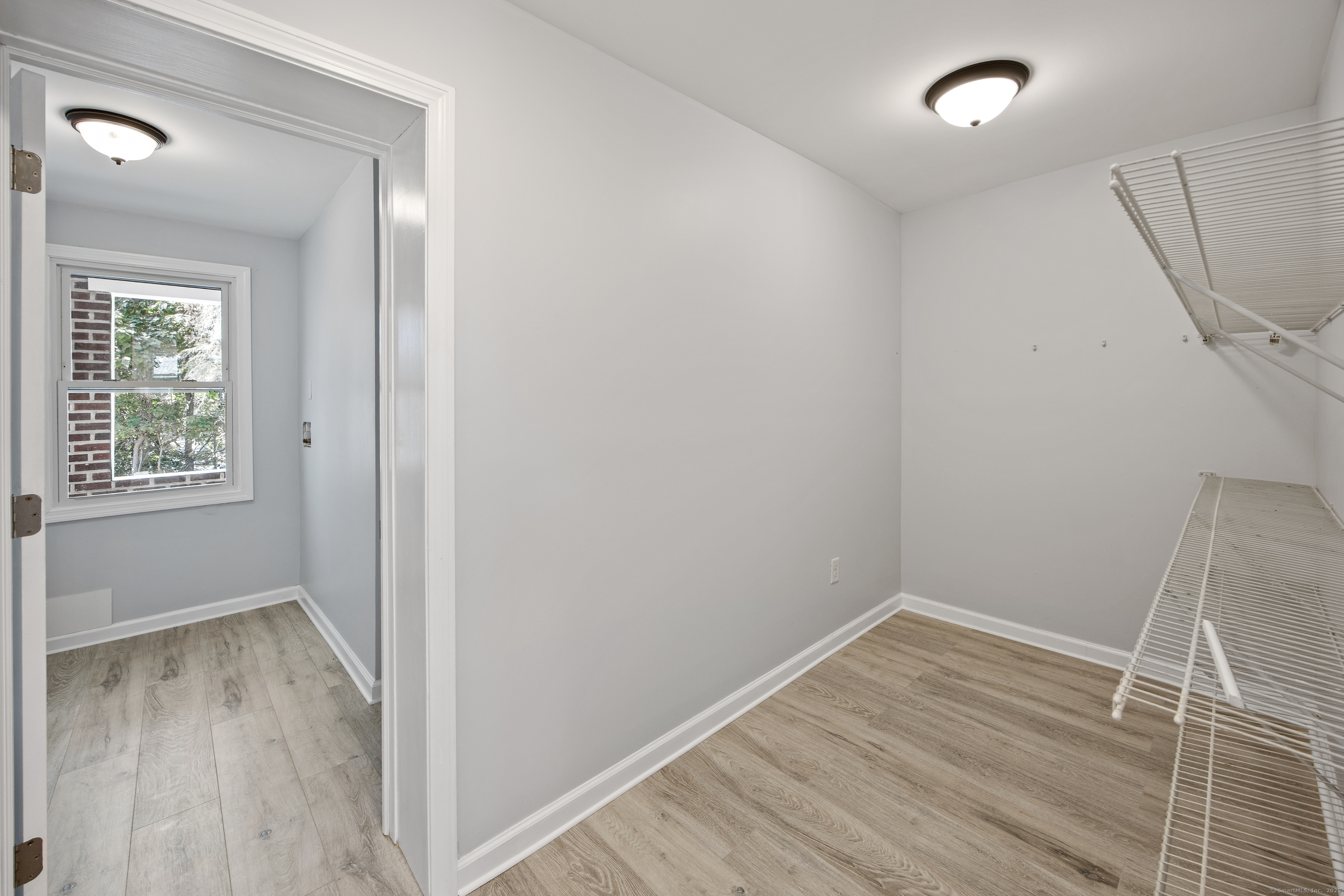 719 High Street Extension Thomaston, CT 06787 - Photo 20 of 38 a view of a room with wooden floor and cabinet