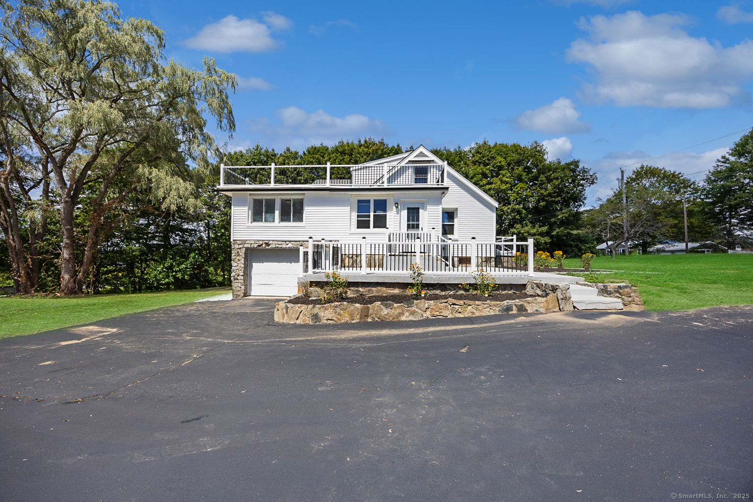 719 High Street Extension Thomaston, CT 06787 - Photo 36 of 38 a view of house with outdoor entertaining space and large trees