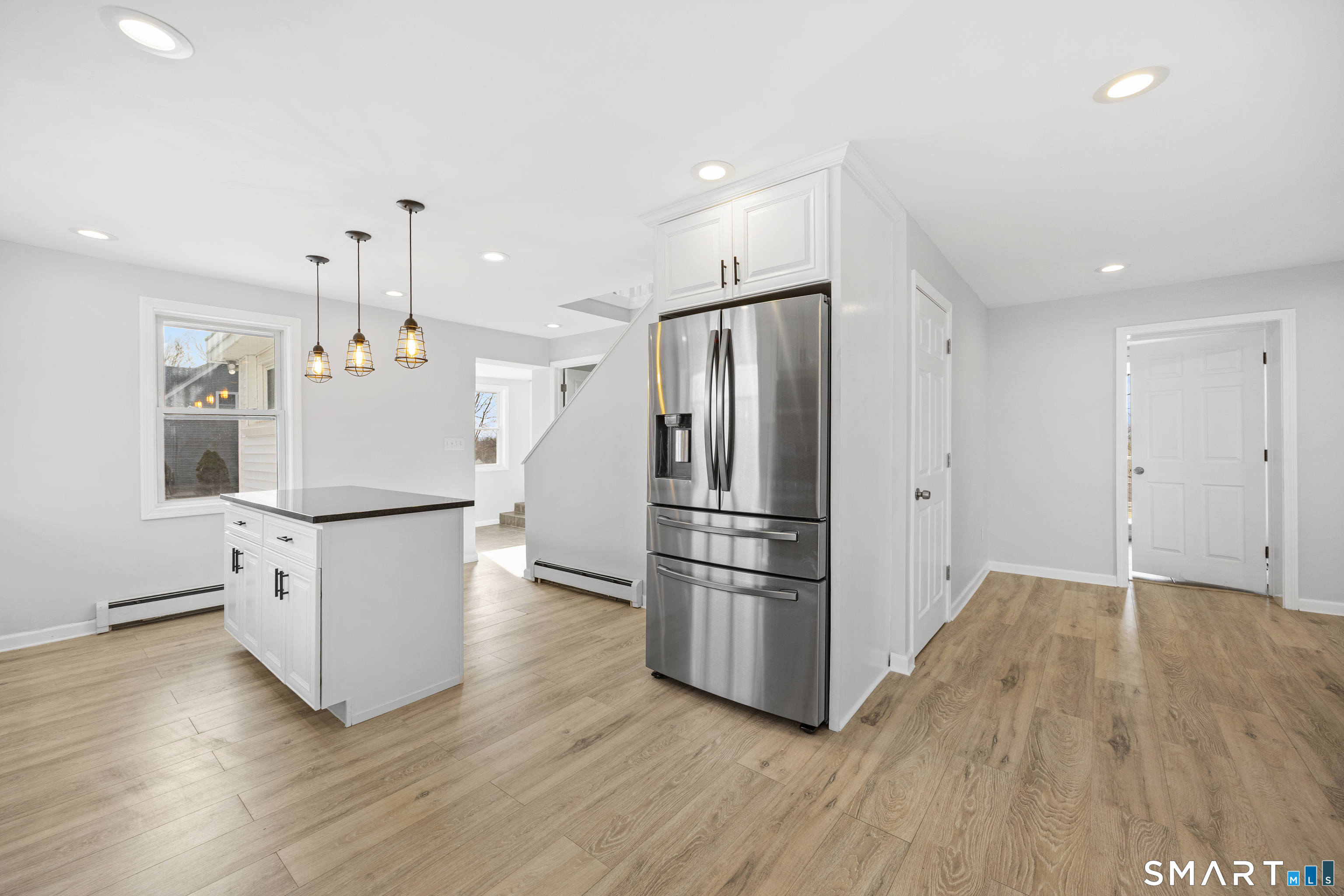 719 High Street Extension Thomaston, CT 06787 - Photo 7 of 38 a kitchen with stainless steel appliances granite countertop a refrigerator a stove a sink dishwasher and a refrigerator with wooden floor