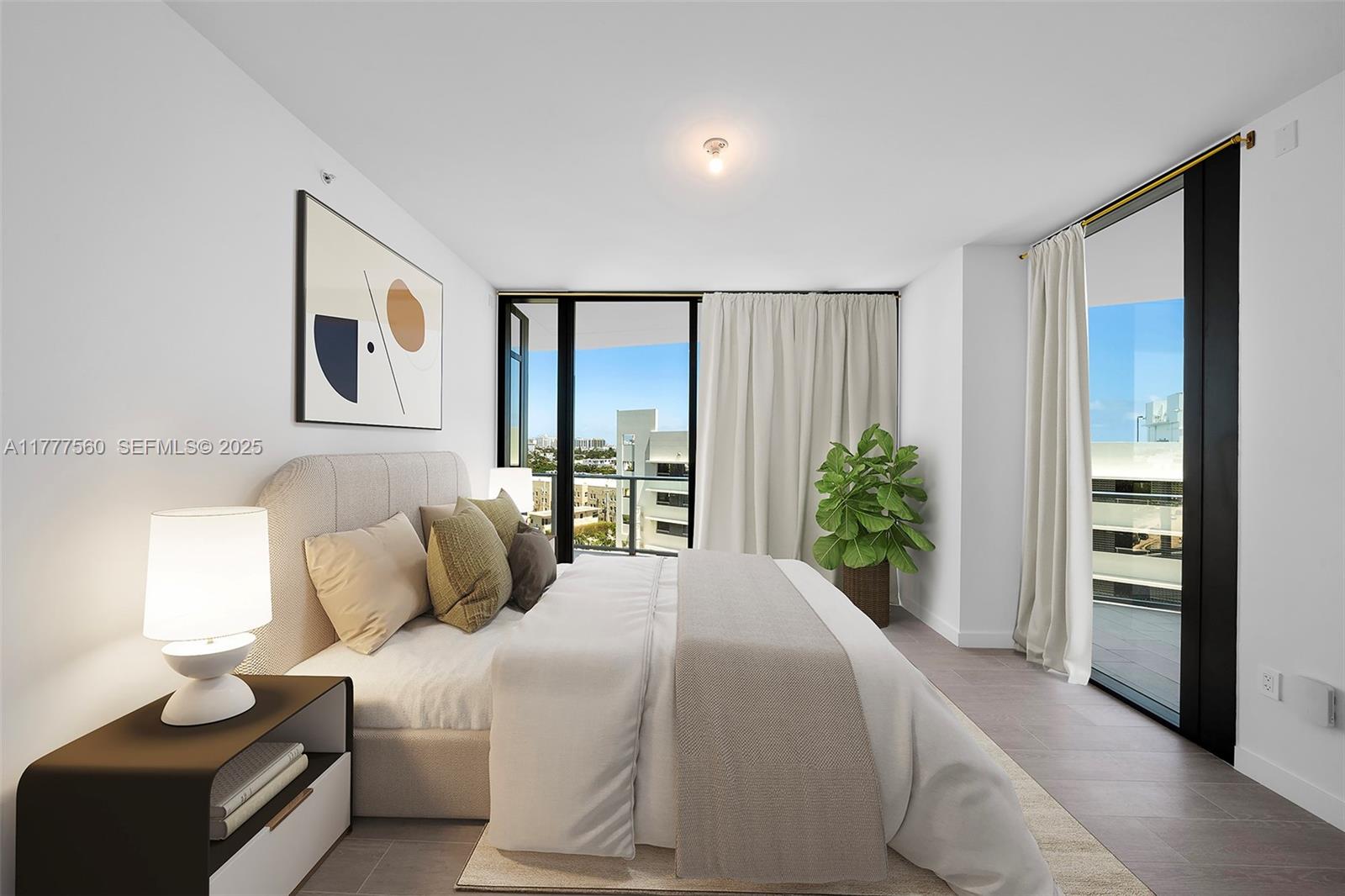 500 Alton Road, Unit 801 Miami Beach, FL 33139 - Photo 11 of 36 a bedroom with a large bed and a window