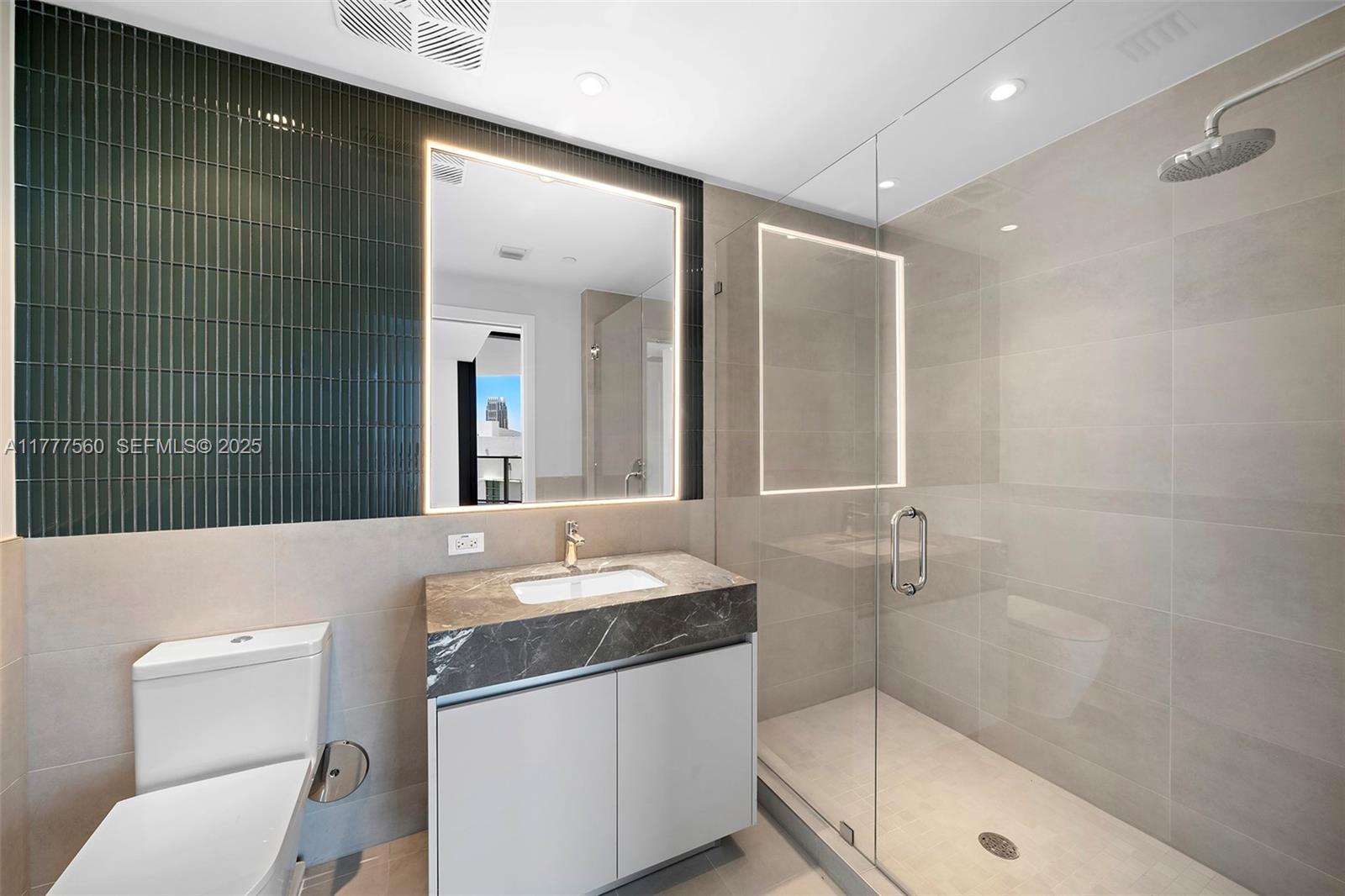 500 Alton Road, Unit 801 Miami Beach, FL 33139 - Photo 15 of 36 a bathroom with a sink a toilet and shower