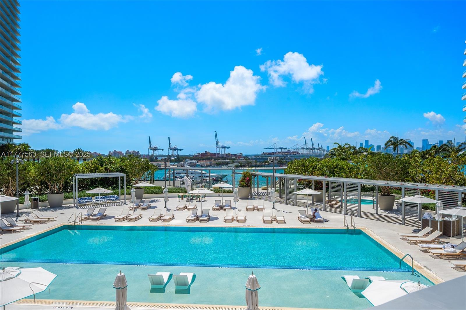 500 Alton Road, Unit 801 Miami Beach, FL 33139 - Photo 17 of 36 a view of a swimming pool with outdoor seating
