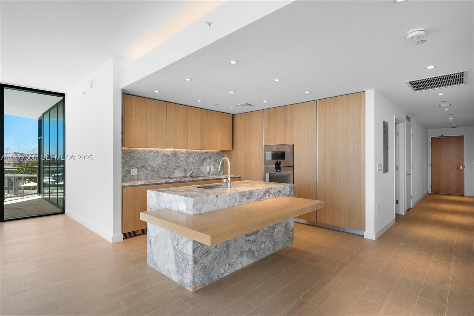 500 Alton Road, Unit 801 Miami Beach, FL 33139 - Photo 6 of 36 a spacious bedroom with a large bed and a couch