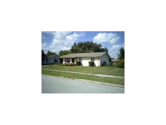 3291 Northeast Fairfax Palm Bay, FL 32905 - Photo 1 of 12 a picture of a person on a field