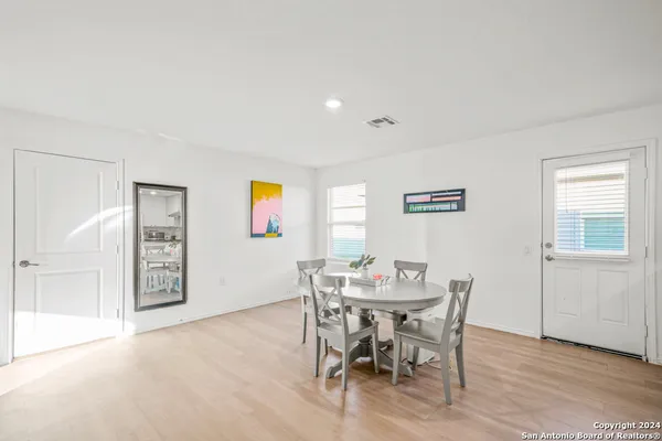 a kitchen with stainless steel appliances granite countertop a sink refrigerator and microwave