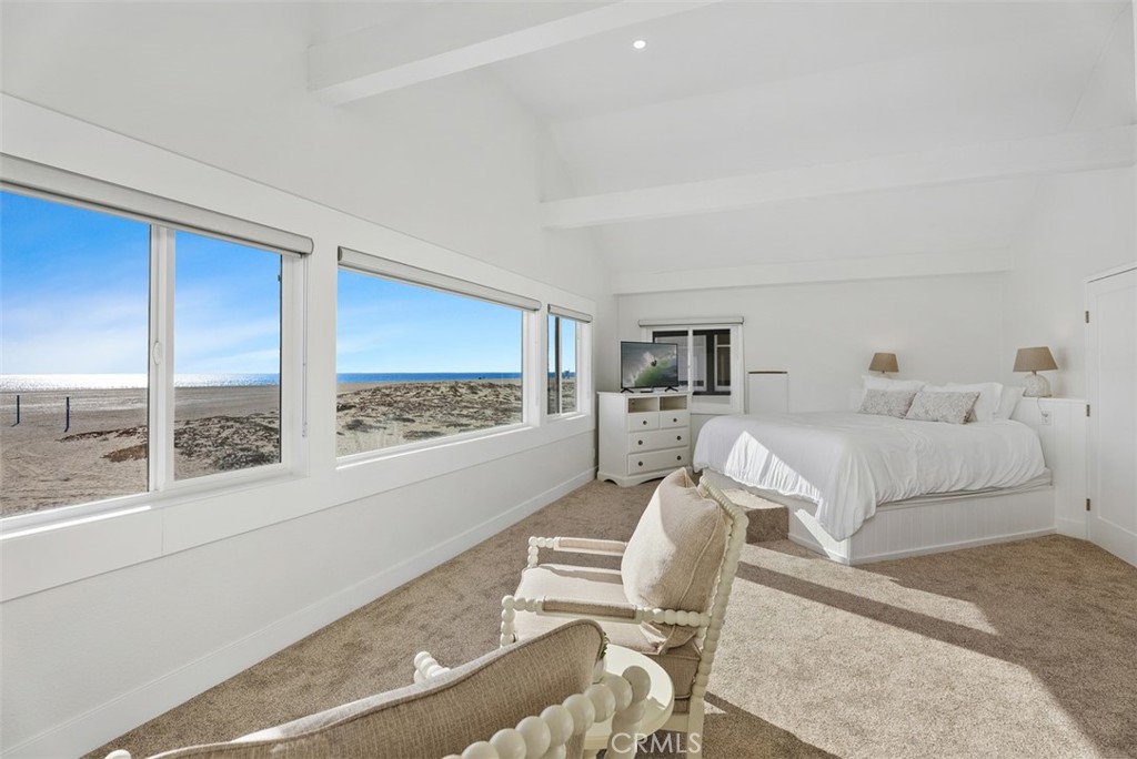 808 West Oceanfront Newport Beach, CA 92661 - Photo 21 of 34 a living room with furniture and a floor to ceiling window