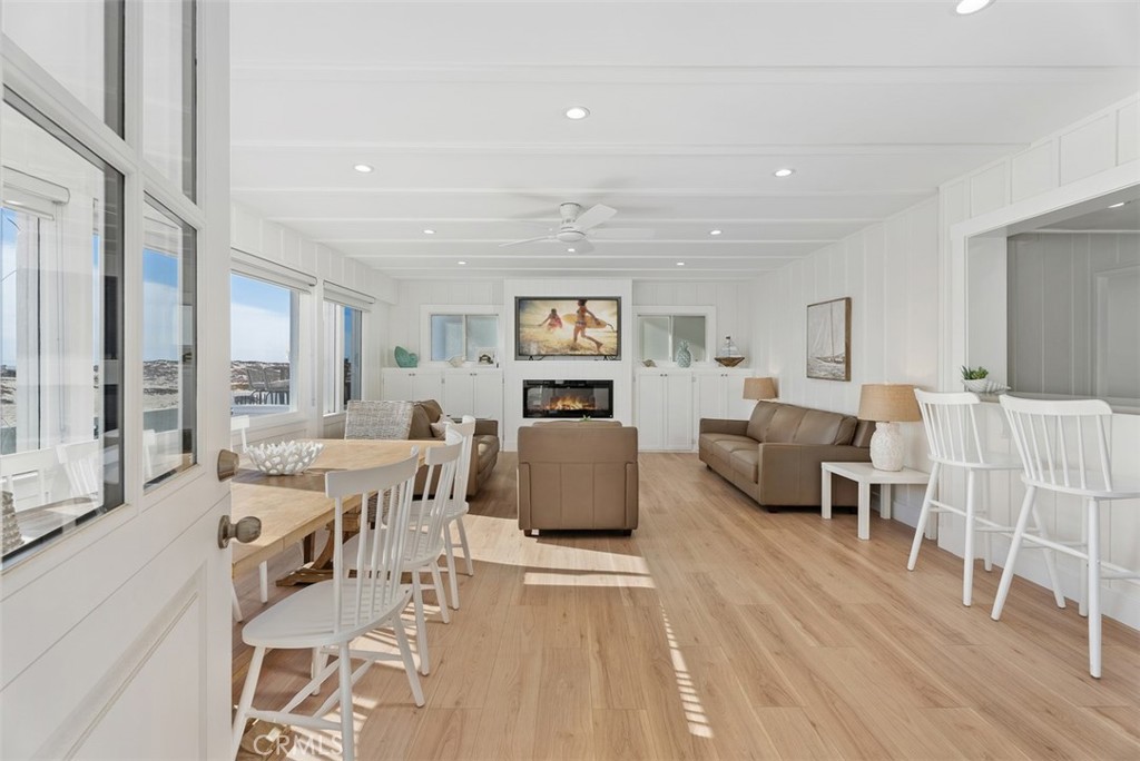 808 West Oceanfront Newport Beach, CA 92661 - Photo 6 of 34 a living room with furniture and a flat screen tv