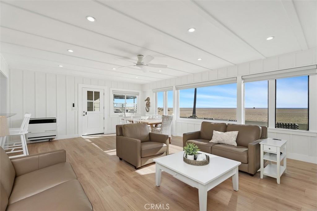808 West Oceanfront Newport Beach, CA 92661 - Photo 8 of 34 a living room with furniture and a window