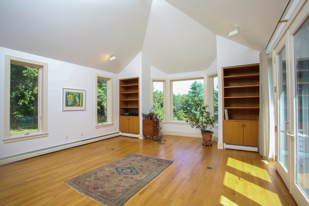 240 Beldingville Road Ashfield, MA 01330 - Photo 11 of 40 a view of an empty room with a window and wooden floor