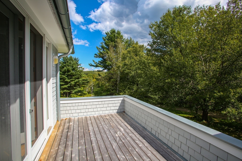 240 Beldingville Road Ashfield, MA 01330 - Photo 13 of 40 a view of balcony with wooden floor and fence