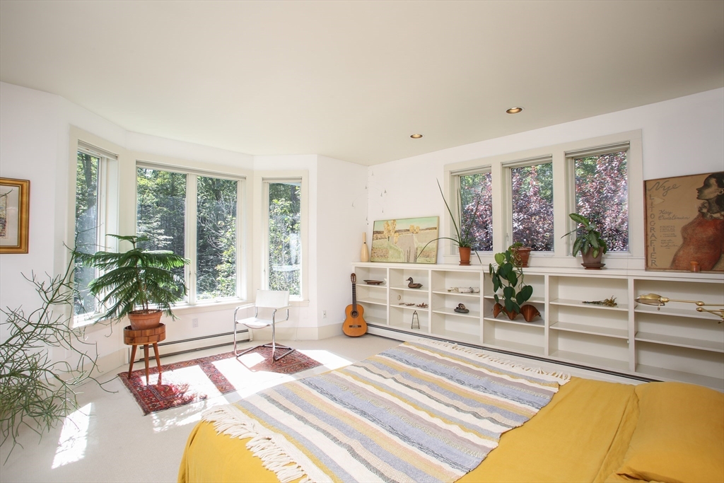 240 Beldingville Road Ashfield, MA 01330 - Photo 21 of 40 a spacious bedroom with a large bed and a large window