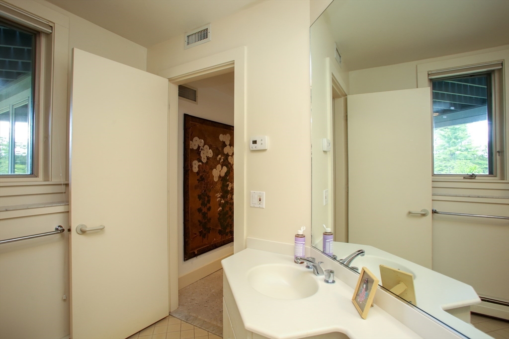 240 Beldingville Road Ashfield, MA 01330 - Photo 29 of 40 a bathroom with a sink and a mirror