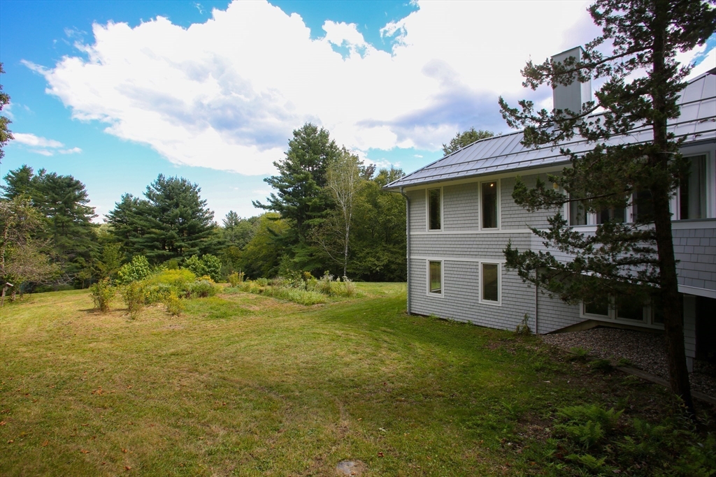 240 Beldingville Road Ashfield, MA 01330 - Photo 35 of 40 a view of a house with a backyard