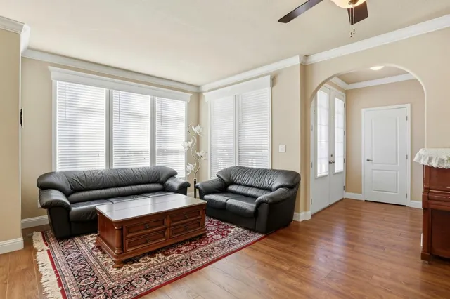 a living room with furniture and a rug