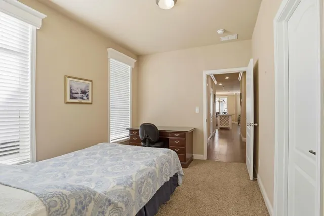 a bedroom with a bed and a table