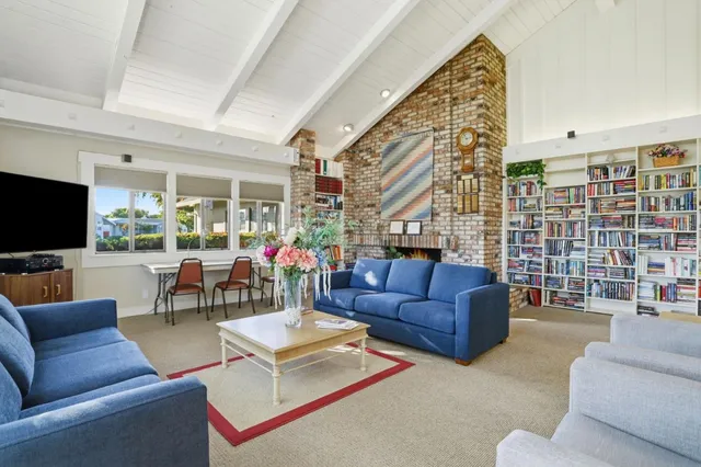 a living room with furniture fireplace and a flat screen tv