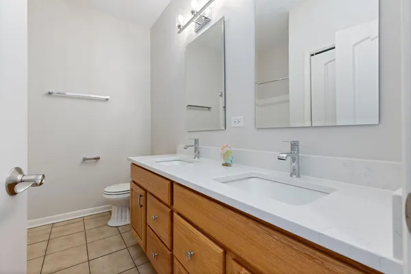 a bathroom with a sink toilet and vanity