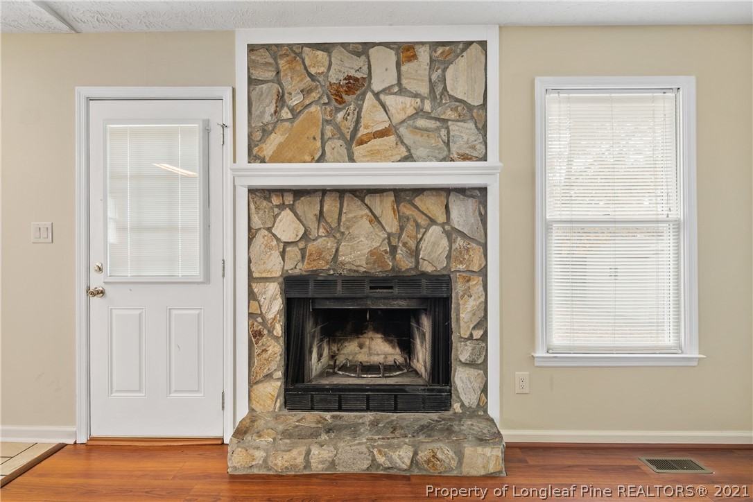 6568 Applewhite Road Fayetteville, NC 28304 - Photo 11 of 46 a living room with a fireplace