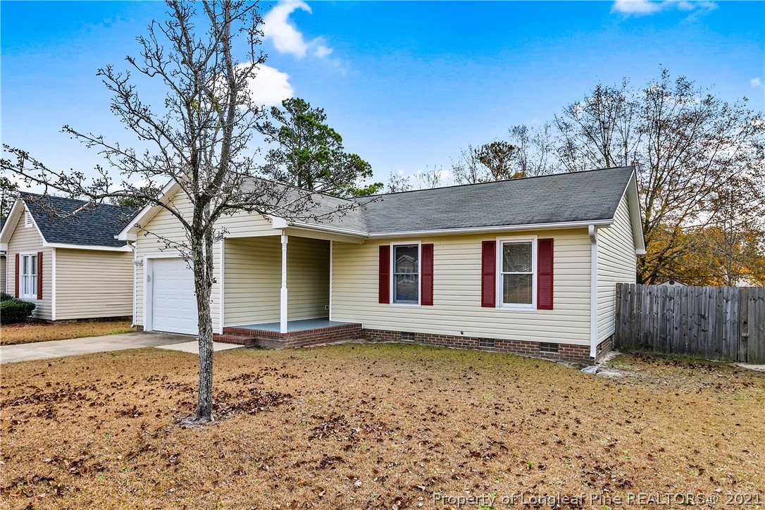 6568 Applewhite Road Fayetteville, NC 28304 - Photo 2 of 46 a front view of a house with a yard