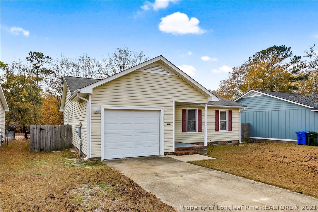 6568 Applewhite Road Fayetteville, NC 28304 - Photo 3 of 46 a view of a house with a backyard