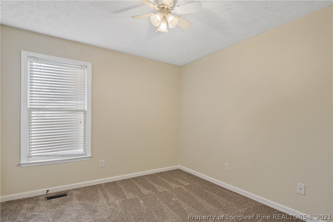 6568 Applewhite Road Fayetteville, NC 28304 - Photo 32 of 46 an empty room with a window