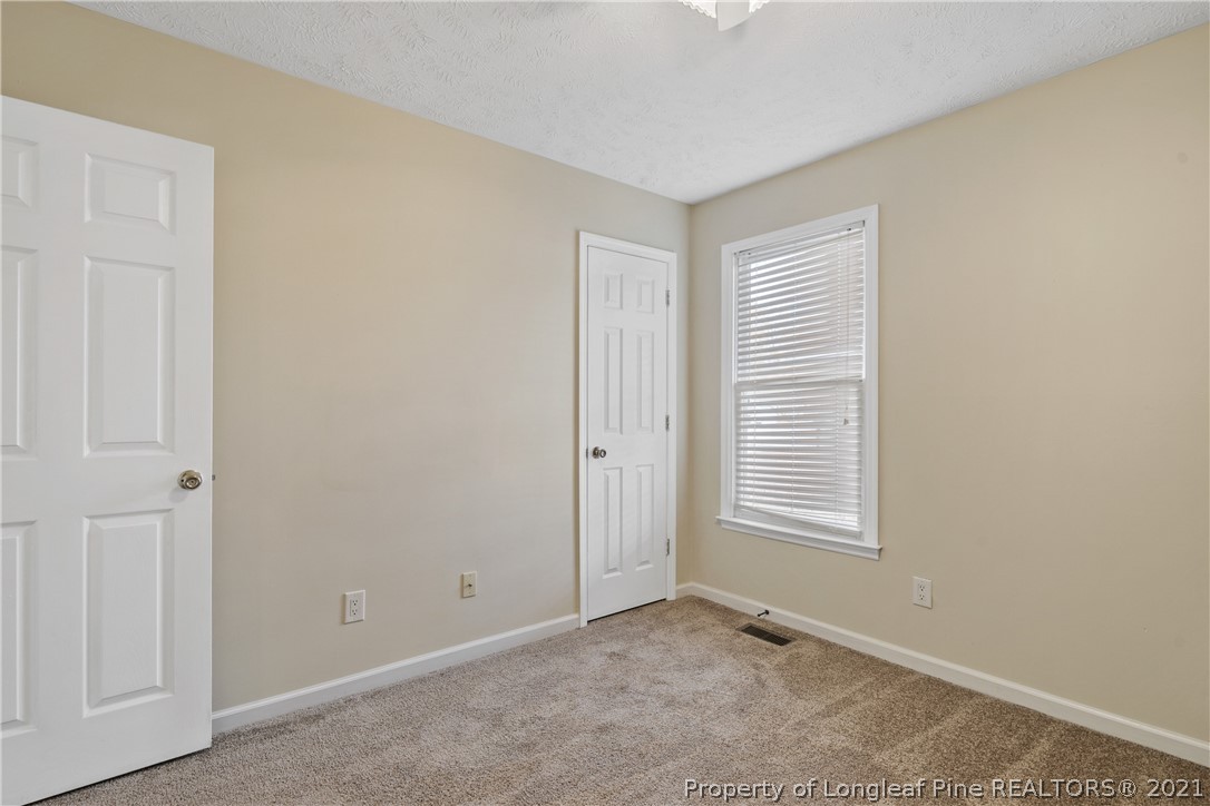 6568 Applewhite Road Fayetteville, NC 28304 - Photo 35 of 46 an empty room with windows