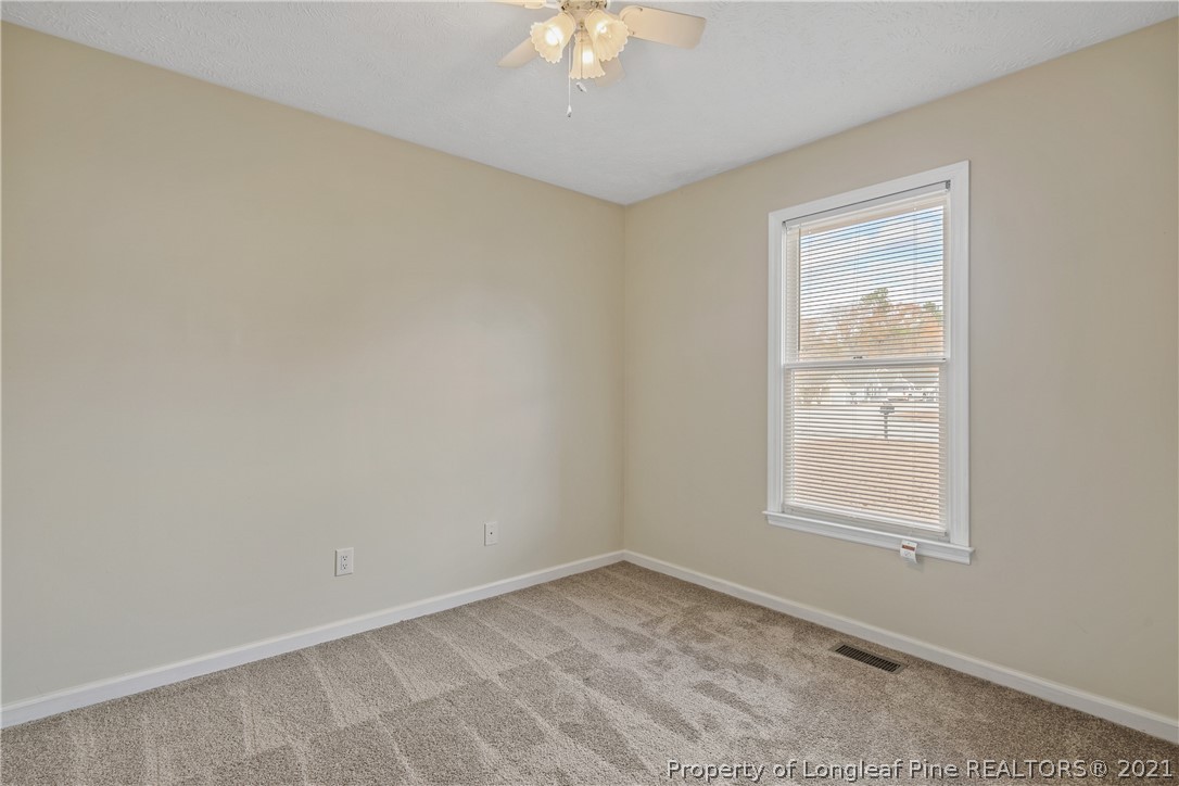 6568 Applewhite Road Fayetteville, NC 28304 - Photo 39 of 46 an empty room with a window