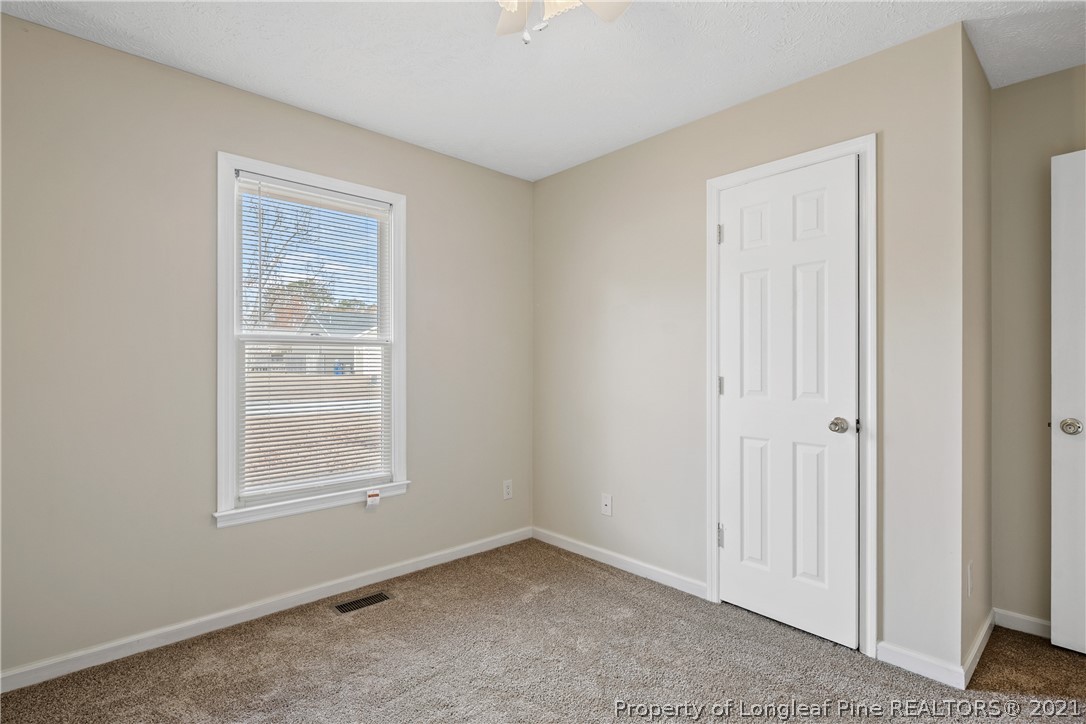 6568 Applewhite Road Fayetteville, NC 28304 - Photo 40 of 46 an empty room with windows