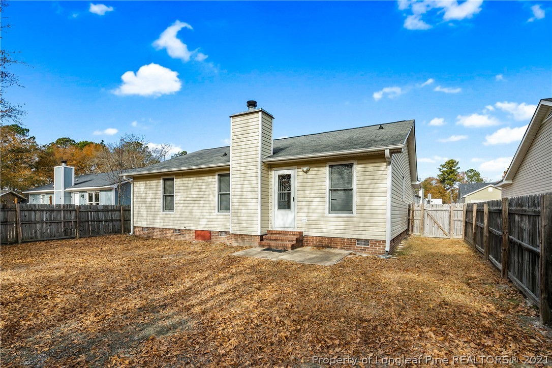 6568 Applewhite Road Fayetteville, NC 28304 - Photo 44 of 46 a view of a house with a backyard